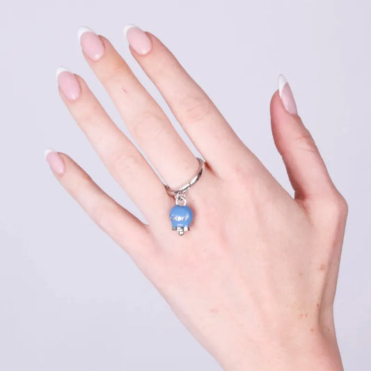 AMO CAPRI - ANELLO ACCIAIO RODIO CON CAMPANELLA MINI AVIO E SCRITTA CAPRI