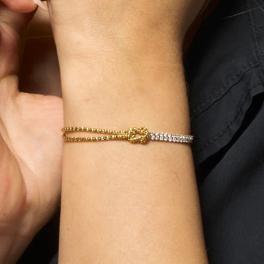 LUCA BARRA - BRACCIALE DONNA IN ACCIAIO DORATO CON NODO E ZIRCONI BIANCHI