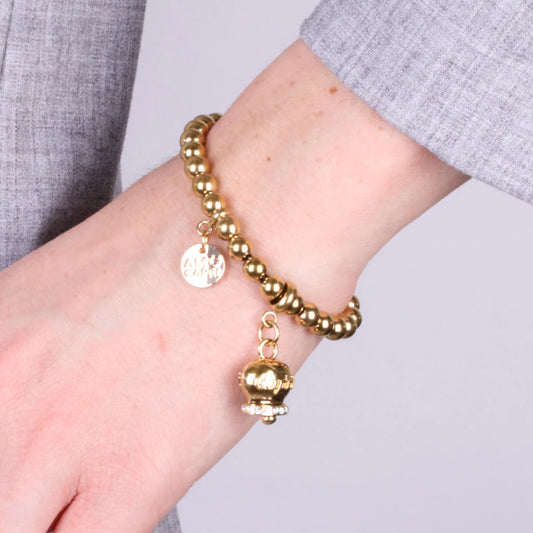 AMO CAPRI - BRACCIALE IN METALLO DORATO CON CAMPANELLA SCRITTA CAPRI