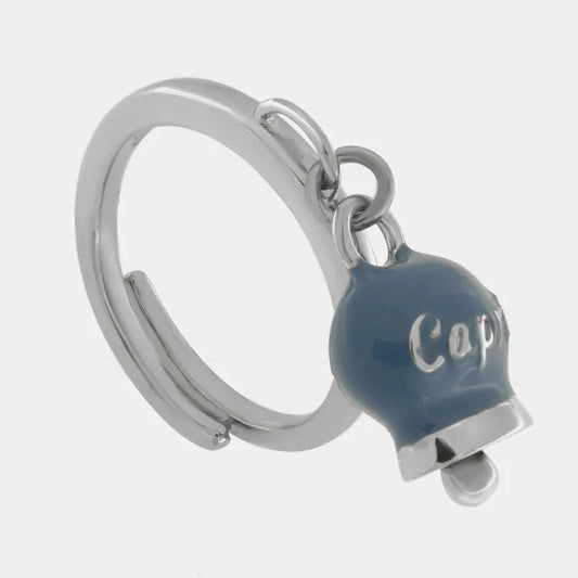 AMO CAPRI - ANELLO ACCIAIO RODIO CON CAMPANELLA MINI AVIO E SCRITTA CAPRI