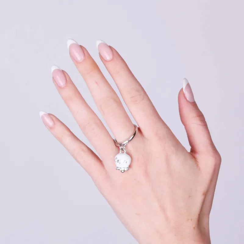 AMO CAPRI - ANELLO ACCIAIO CON CAMPANELLA SMALTO BIANCO E CRISTALLI