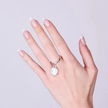 AMO CAPRI - ANELLO ACCIAIO CON CAMPANELLA SMALTO BIANCO E CRISTALLI