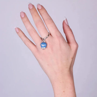 AMO CAPRI - ANELLO ACCIAIO CON CAMPANELLA SMALTO AVIO E CRISTALLI