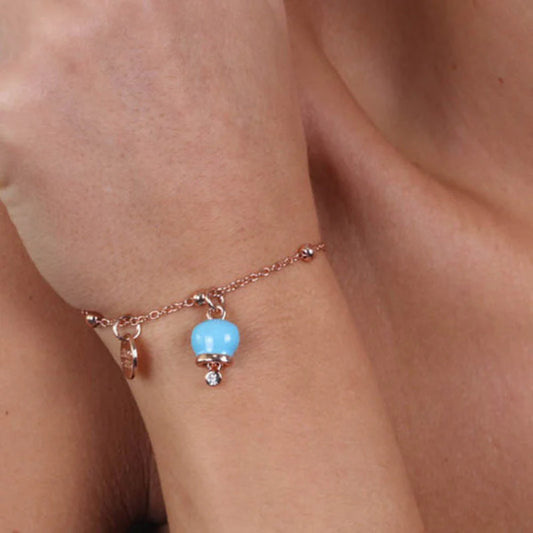 AMO CAPRI - BRACCIALE IN METALLO ROSE' CON CAMPANELLA MINI TURCHESE E PUNTO LUCE