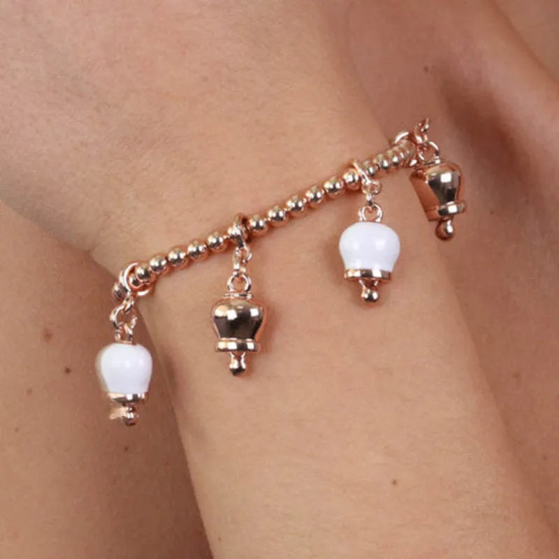 AMO CAPRI - ROSE METAL BRACELET WITH WHITE AND ROSE BELLS