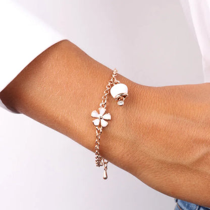 AMO CAPRI - ROSE METAL BRACELET WITH BELL AND WHITE DAISIES