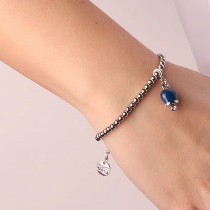 AMO CAPRI - BRACCIALE IN METALLO CON SFERE PICCOLE E CAMPANELLA MINI BLU