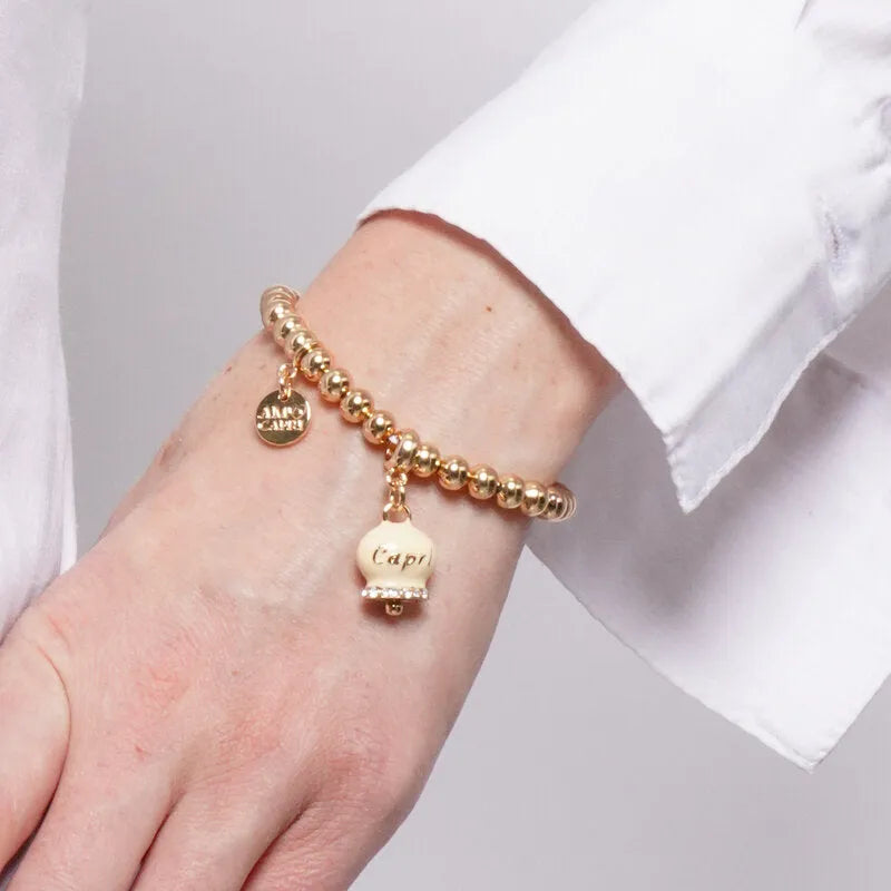AMO CAPRI - BRACCIALE IN METALLO DORATO CAMPANELLA CREMA SCRITTA CAPRI