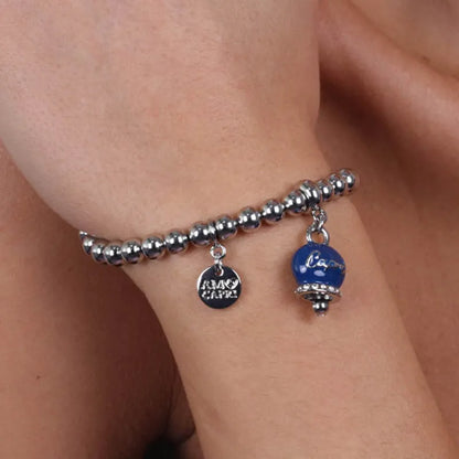 AMO CAPRI - BRACCIALE IN METALLO CON CAMPANELLA SMALTO BLU E SCRITTA CAPRI