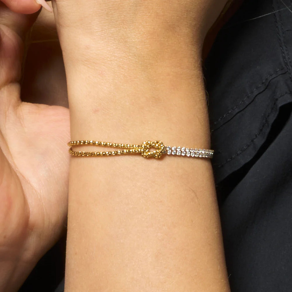 LUCA BARRA - BRACCIALE DONNA IN ACCIAIO DORATO CON NODO E ZIRCONI BIANCHI