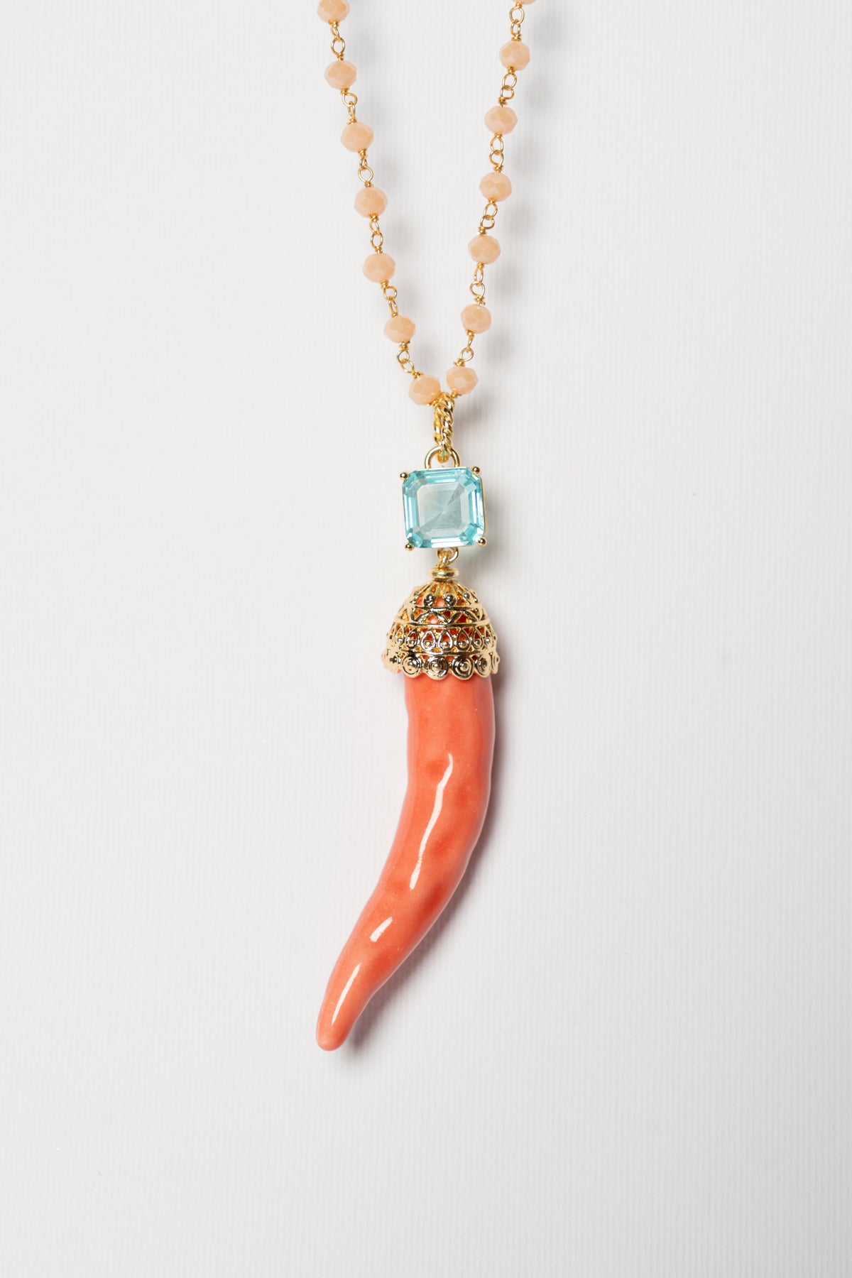 SICYLUI - COLLANA CORNO IN CERAMICA SALMONE CON CRISTALLO CENTRALE CELESTE