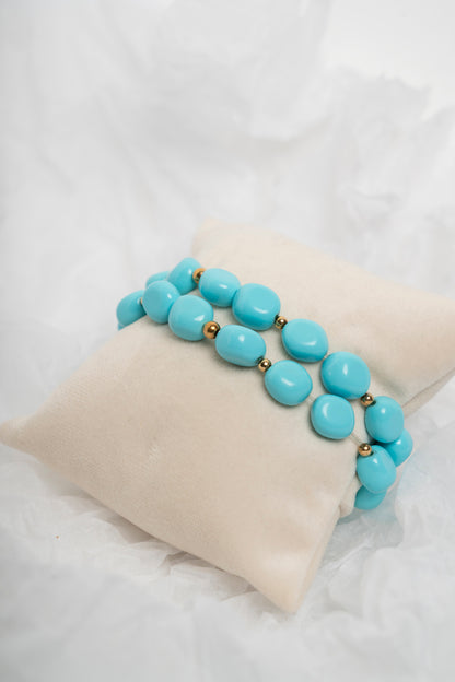 SOARA - BRACCIALE ELASTICO MULTIFILO IN TURCHESE E CENTRALE IN ARGENTO DORATO