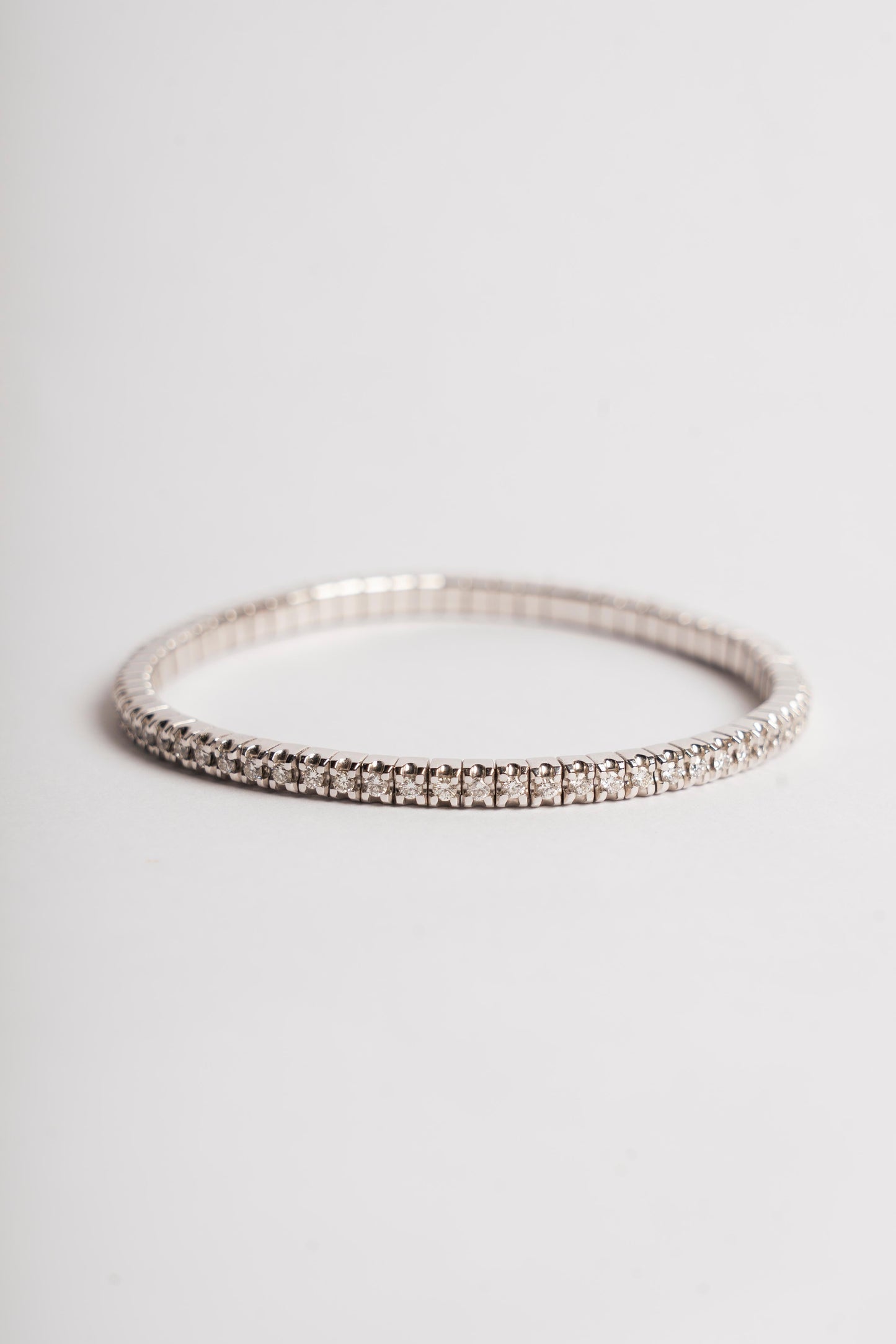 MANO J - TENNIS ELASTICO ORO BIANCO E DIAMANTI BIANCHI