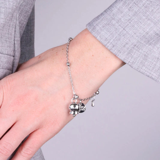 AMO CAPRI - BRACCIALE IN ACCIAIO CON CAMPANELLA PICCOLA RODIO SCRITTA CAPRI