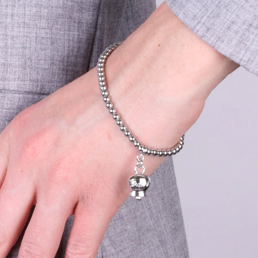 AMO CAPRI - BRACCIALE IN ACCIAIO CON CAMPANELLA PICCOLA RODIO SCRITTA CAPRI