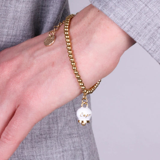 AMO CAPRI - BRACCIALE IN ACCIAIO CON CAMPANELLA PICCOLA BIANCA SCRITTA CAPRI