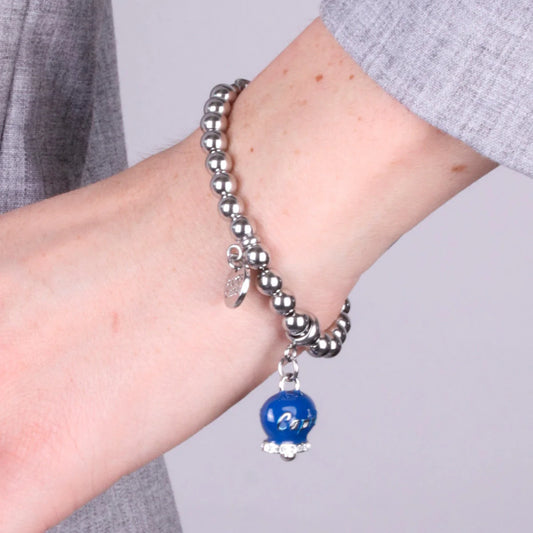 AMO CAPRI - BRACCIALE IN ACCIAIO CON CAMPANELLA BLU SCRITTA CAPRI E ZIRCONI