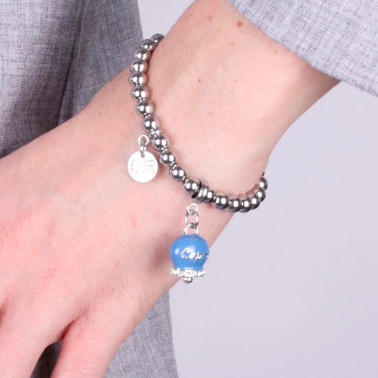 AMO CAPRI - BRACCIALE IN ACCIAIO CON CAMPANELLA AVIO SCRITTA CAPRI E CRISTALLI