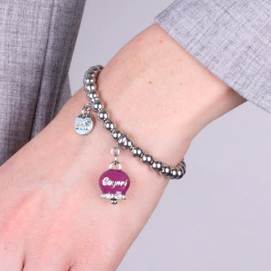AMO CAPRI - BRACCIALE IN ACCIAIO CON CAMPANELLA BORGOGNA SCRITTA CAPRI E CRISTALLI
